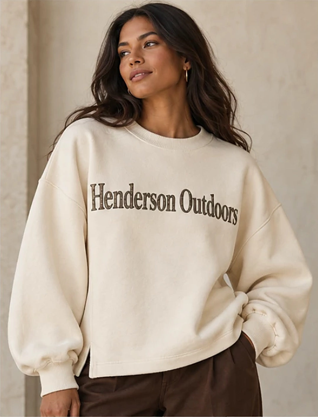 Woman wearing the Henderson Outdoors bone crew with camo Henderson Outdoors letters across the chest