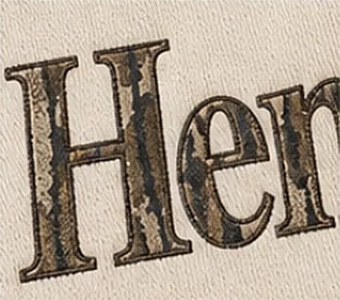 Close-up of the camo letters with dark stitched borders